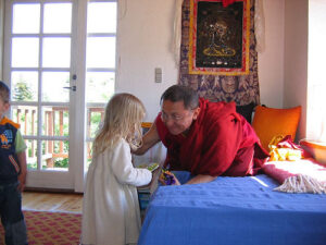 choky nyima rinpoche blesses a child